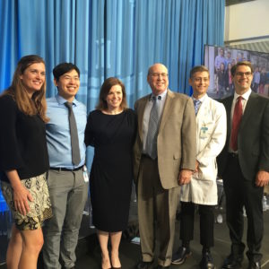 Pope Foundation Board Member Joyce L. Pope and Chairman Art Pope (center), meet with the 2018 'Pope Clinical Fellows' (pictured to the left and right) during the April 23, 2018, announcement of a $10 million commitment to Chapel Hill. 